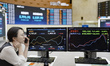 An electronic scoreboard at the Korea Exchange (KRX) in Seoul, South Korea, on March 3, 20...