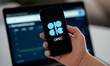 The Organization of the Petroleum Exporting Countries (OPEC) logo is displayed on a mobile...