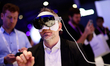 The Samsung XR Glasses extended reality wearable by Samsung is worn by a congress attendee...