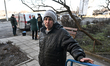 A local resident, Tetiana Vasylivna, talks to the press during evacuation from the frontli...
