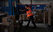 Workers load parcels at the LJR warehouse in Jakarta, Indonesia, on March 4, 2026. As the...