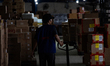 Workers load parcels at the LJR warehouse in Jakarta, Indonesia, on March 4, 2026. As the...