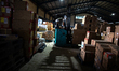 A worker loads parcels using a reach truck at the LJR warehouse in Jakarta, Indonesia, on...