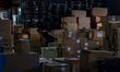 A worker loads parcels at the LJR warehouse in Jakarta, Indonesia, on March 4, 2026. As th...