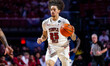 Aiden Tobiason, 25, of the Temple Owls possesses the ball during an NCAA men's basketball...