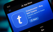 The Ticketmaster logo appears on a smartphone screen in the Apple app store in this photo...