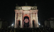 The Winter Paralympic flame light show takes place at Arco della Pace as part of the openi...