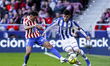 In Madrid, Spain, on March 7, Ander Barrenetxea of Real Sociedad and Nahuel Molina of Atle...