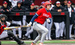 Chris Carson (4) of the Stony Brook Seawolves hits the ball during an NCAA baseball game a...