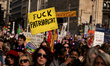 People attend a march during International Women's Rights Day in Brussels, Belgium, on Mar...