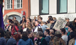 Participants with banners and signs gather during the International Women's Day rally at R...