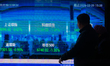 A digital display stock index is seen in Lujiazui, China, on March 9, 2026, as the stock t...