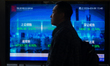 A digital display stock index is seen in Lujiazui, China, on March 9, 2026, as the stock t...