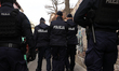 In Krakow, Poland, on March 8, 2026, police officers participate in a protest against the...