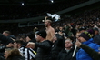 Fans of Newcastle United celebrate Harvey Barnes's goal during the UEFA Champions League R...