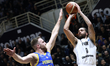 PAOK player Timmy Allen challenges for the ball with Peristeri player Dimitris Kaklamanaki...