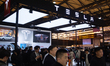 Fairgoers are seen at the Tesla booth at the SNEIC expo center in Shanghai, China, on Marc...