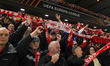 Forest supporters hold scarves during the UEFA Europa League Round of 16, 1st Leg match be...