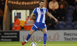 Tom Flanagan of Colchester United passes the ball during the Sky Bet League 2 match betwee...