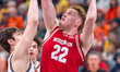 Austin Rapp #22 of the Wisconsin Badgers tries to find the rim against the Illinois Fighti...