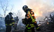 Firefighters extinguish a fire in Zaporizhzhia, Ukraine, on March 14, 2026. The fire was c...