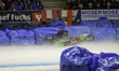 Johann Weber (33) of Germany spins off behind Heikki Husko (67) of Finland during the Ice...