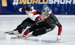 William Dandjinou of Canada skates ahead of Felix Pigeon of Poland in the Men's 500m Final...
