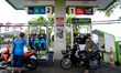 People refuel their motorcycles with gas at a Bangchak Corporation Public Company Limited...