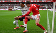 Neco Williams of Nottingham Forest competes with Kenny Tete of Fulham during the Premier L...