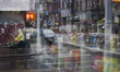 A view from inside a convenience store in the Chinatown neighborhood as rain moves into Ma...