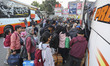 Passengers prepare to depart for their hometowns ahead of the Muslim Eid al-Fitr holiday a...