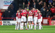Walsall FC team huddles at kick-off during the Sky Bet League 2 match between Walsall and...