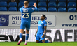 Kyrell Lisbie of Peterborough United celebrates after scoring the team's first goal during...