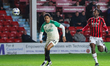 Mamadou Jobe of Cambridge United and Daniel Kanu of Walsall FC chase after the ball as Cam...