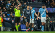 Referee Clement Turpin gives a red card to Bernardo Silva of Manchester City during the UE...