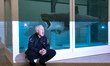 British visual artist Damien Hirst poses in front of his artwork, 'The Physical Impossibil...