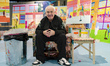 British visual artist Damien Hirst poses for photographs inside a recreation of his person...