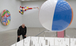 British visual artist Damien Hirst poses with his artwork 'The Fragility of Love' during a...