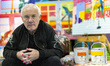 British visual artist Damien Hirst poses for photographs inside a recreation of his person...