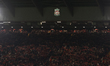 Liverpool fans hold up their scarves as they sing a rendition of ''You'll Never Walk Alone...