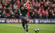 Liverpool goalkeeper Alisson Becker rolls out the ball during the UEFA Champions League la...