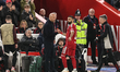 Arne Slot, manager of Liverpool, shakes hands with Mohamed Salah of Liverpool after Salah...