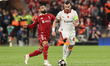 Stefan Bajcetic of Liverpool breaks with the ball tracked by Mohamed Salah of Liverpool du...