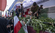 A truck carries the coffins of the crew of the sunken IRIS Dena during a funeral for Ali L...