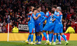 Atletico Madrid players celebrate their first goal during the UEFA Champions League match...