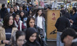 Iranian women walk past a portrait of the late Supreme Leader, Ayatollah Ali Khamenei, dur...