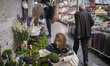 A young Iranian woman looks at green sprouts, a key symbol of the Iranian New Year, during...