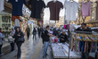 An Iranian man shops from a street vendor during New Year shopping in northern Tehran, Ira...
