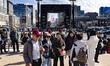 People gather at Gwanghwamun Square in Seoul, South Korea, on March 19, 2026, to observe t...