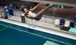 An athlete performs a springboard dive during a scheduled training session of the Ukraine...